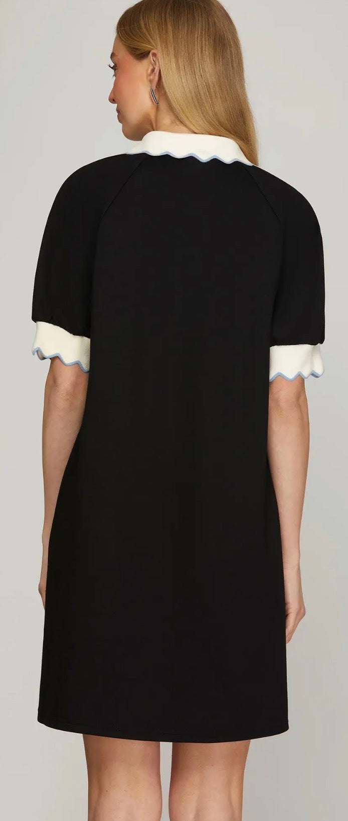 Black with blue zip front dress with white sleeve trim