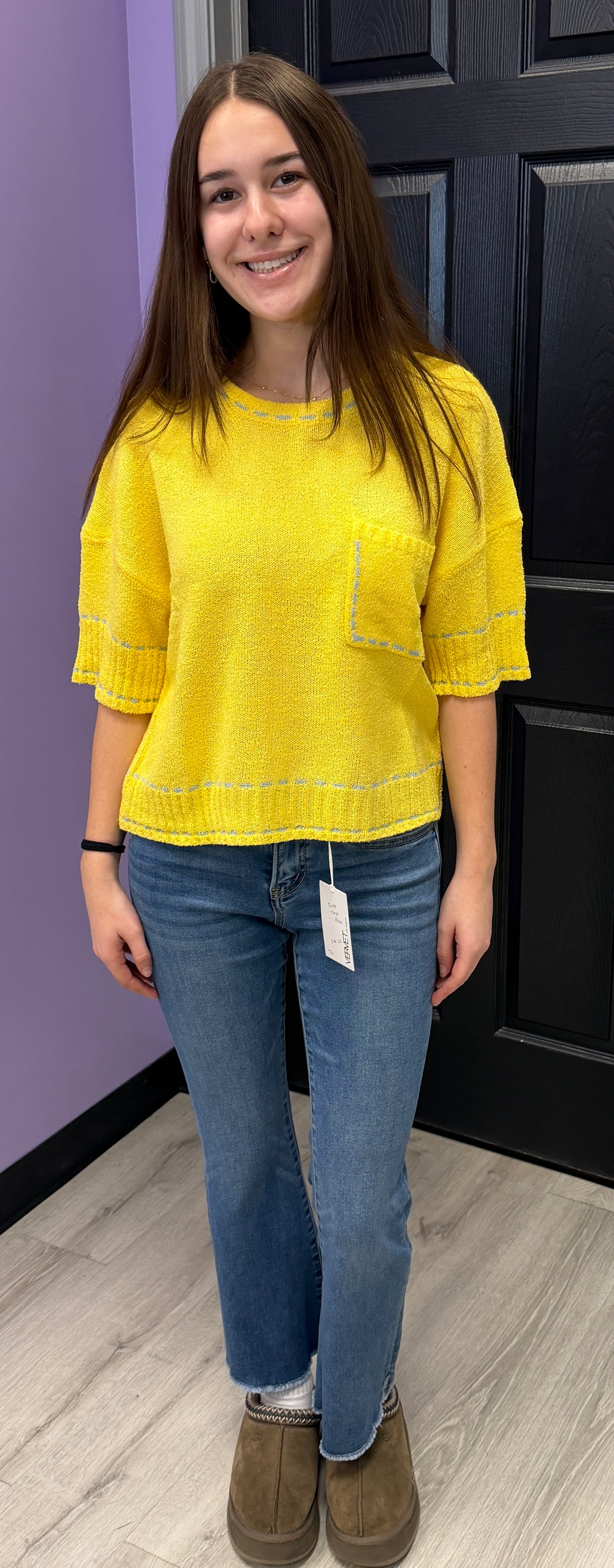 Yellow soft knit short sleeve top with blue stitching