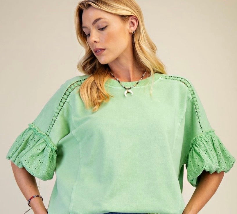 Apple green sweatshirt with puff sleeves and eyelet detail
