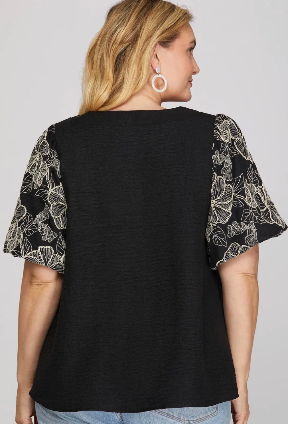 Black top with black/white embroidered puff sleeves, available sizes Small through 2X