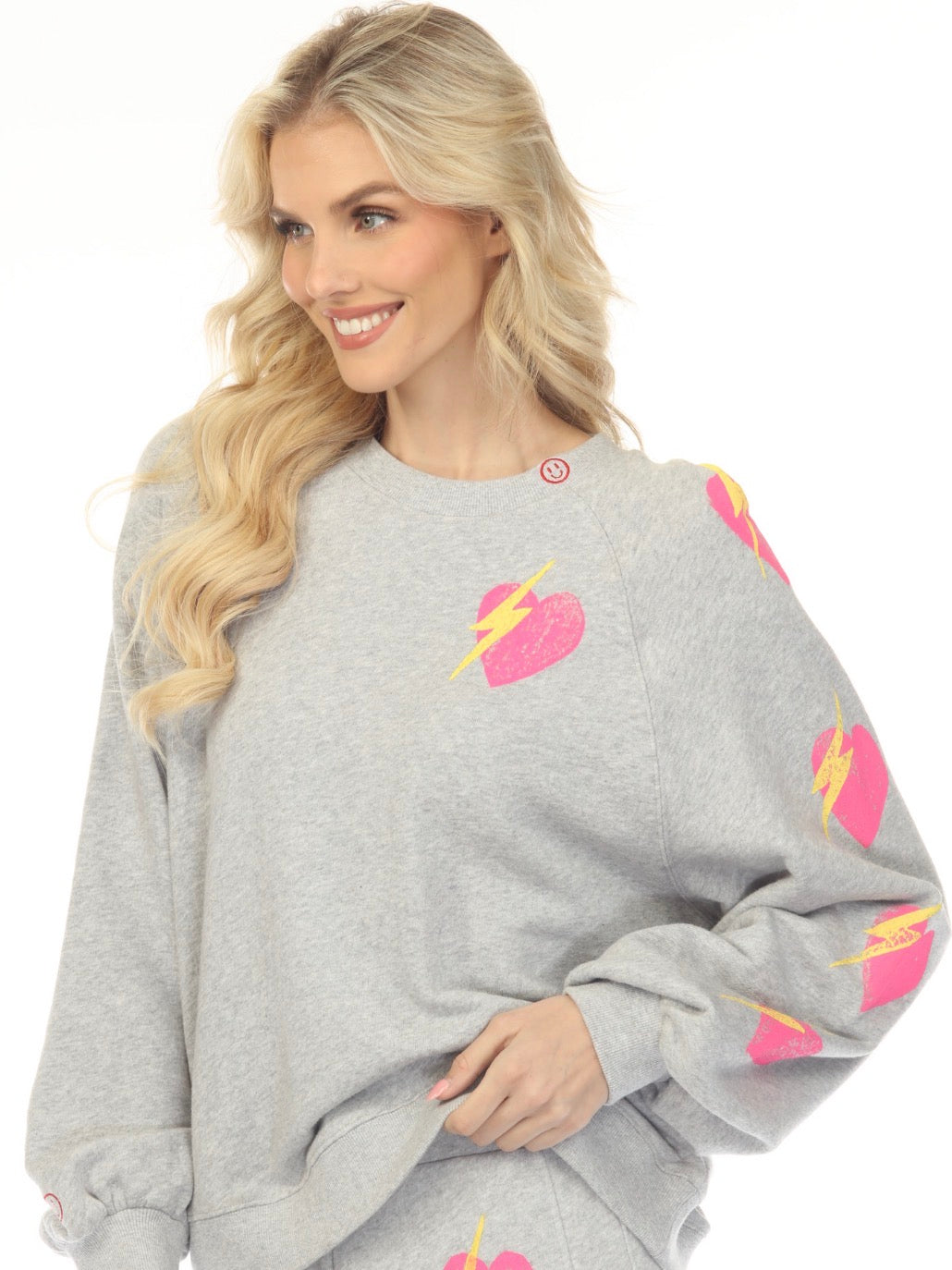 Grey french terry sweatshirt with the pink hearts with bolts and small smileys