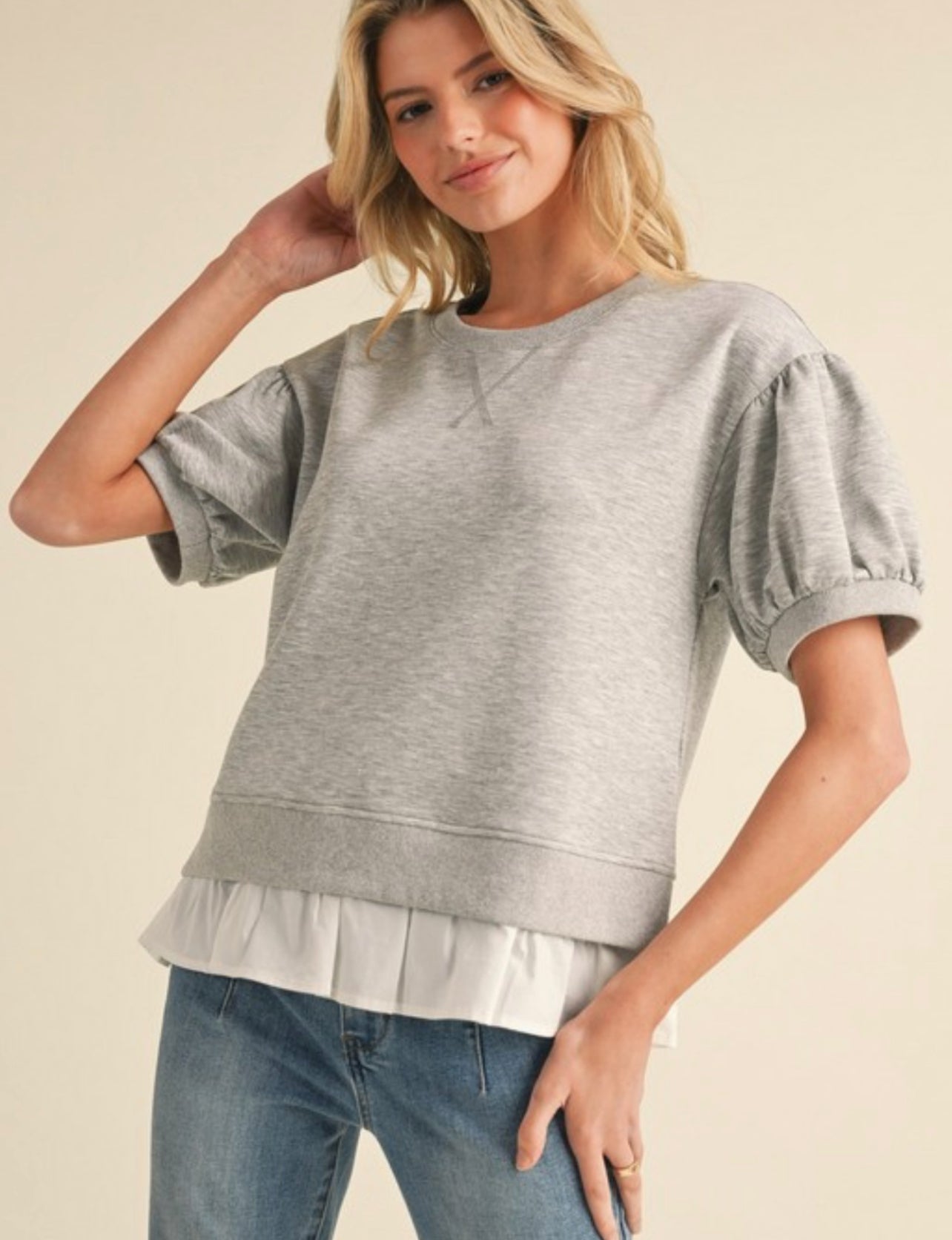 Heather grey short sleeve sweatshirt with white flounce bottom