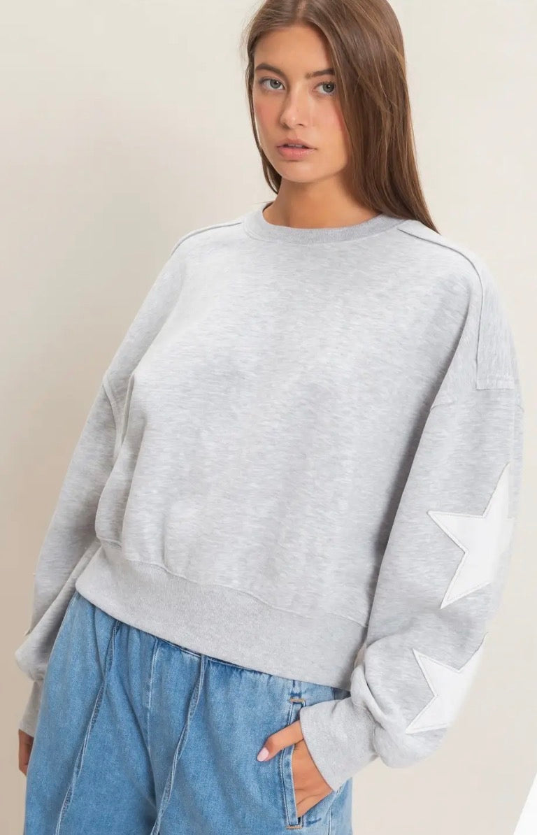 Grey sweatshirt with white stars on sleeves