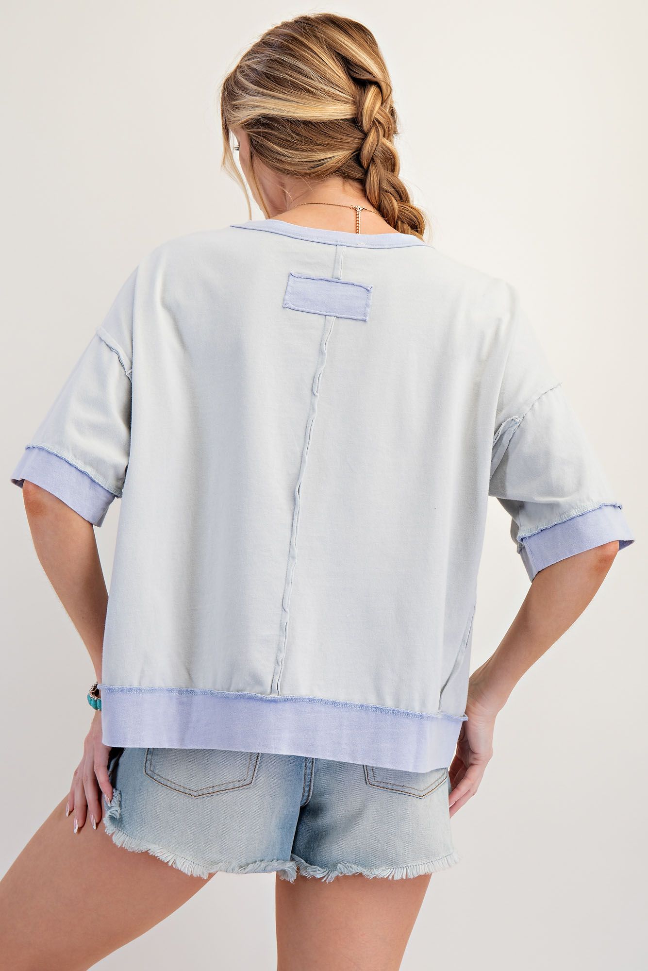 Blue top with stud star and floral outline