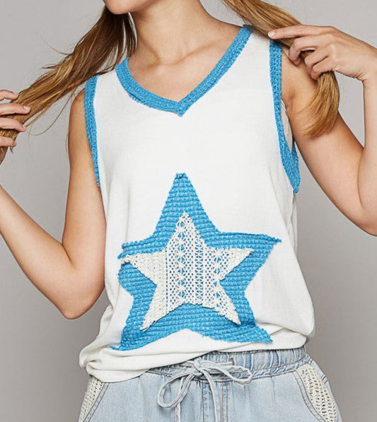 Ivory/blue tank with star patch on front and back