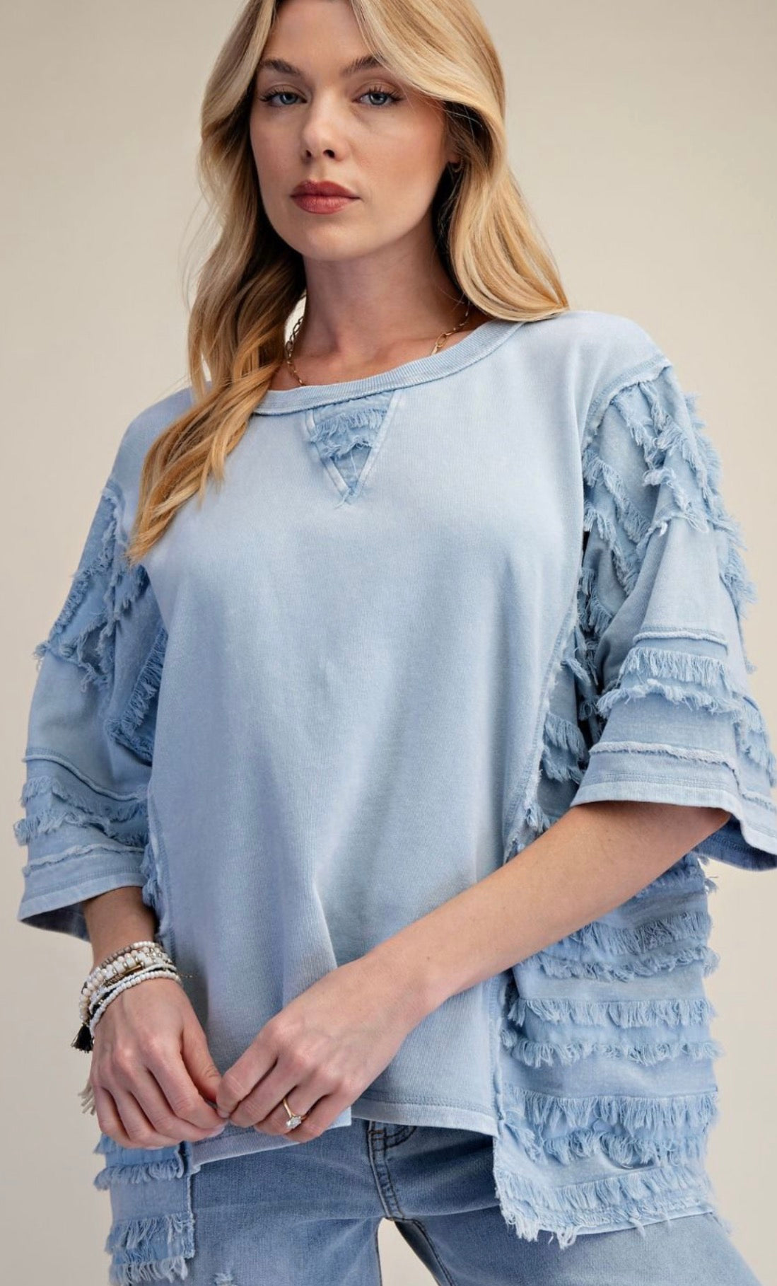 Blue loose fit top with fray detail