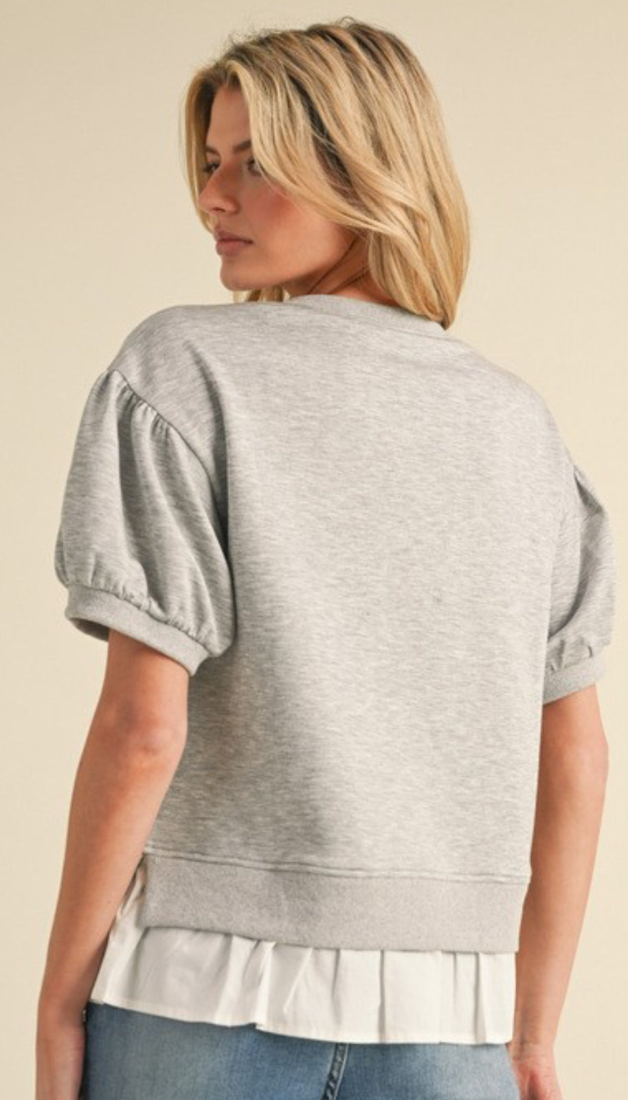 Heather grey short sleeve sweatshirt with white flounce bottom
