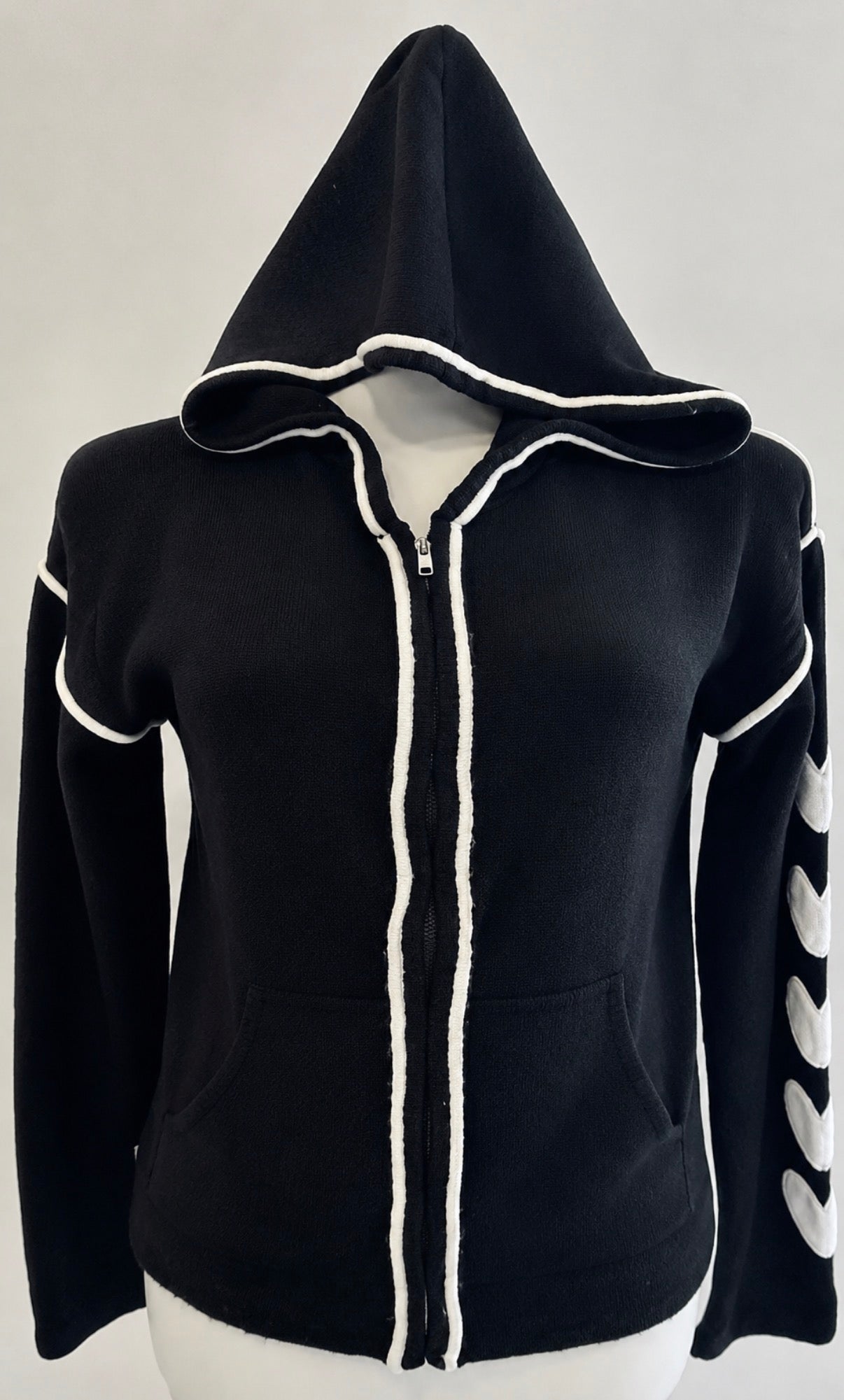 Black soft knit zip up with white hearts sleeves