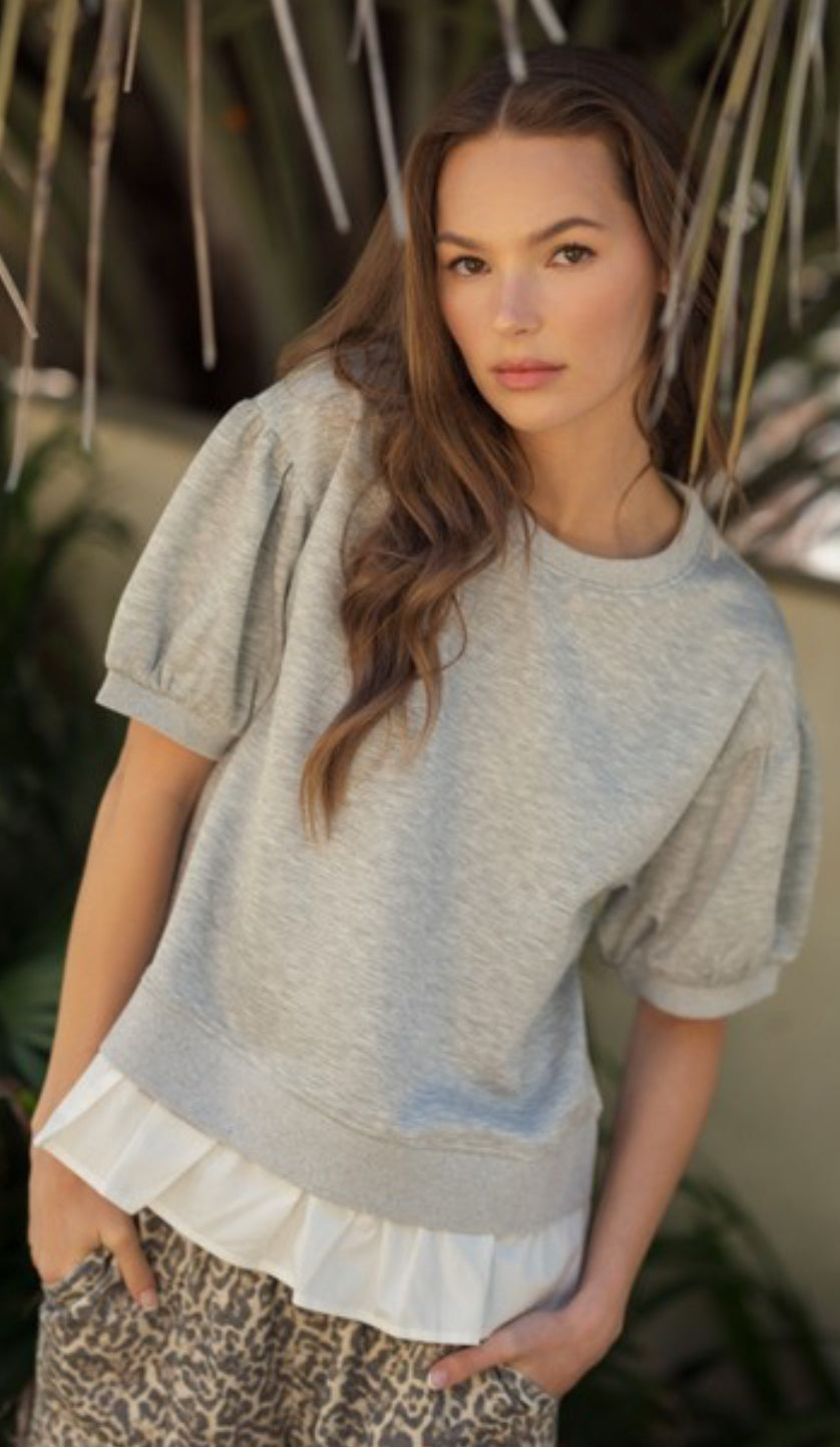 Heather grey short sleeve sweatshirt with white flounce bottom