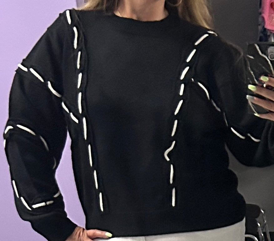 THML black sweater with white stitching