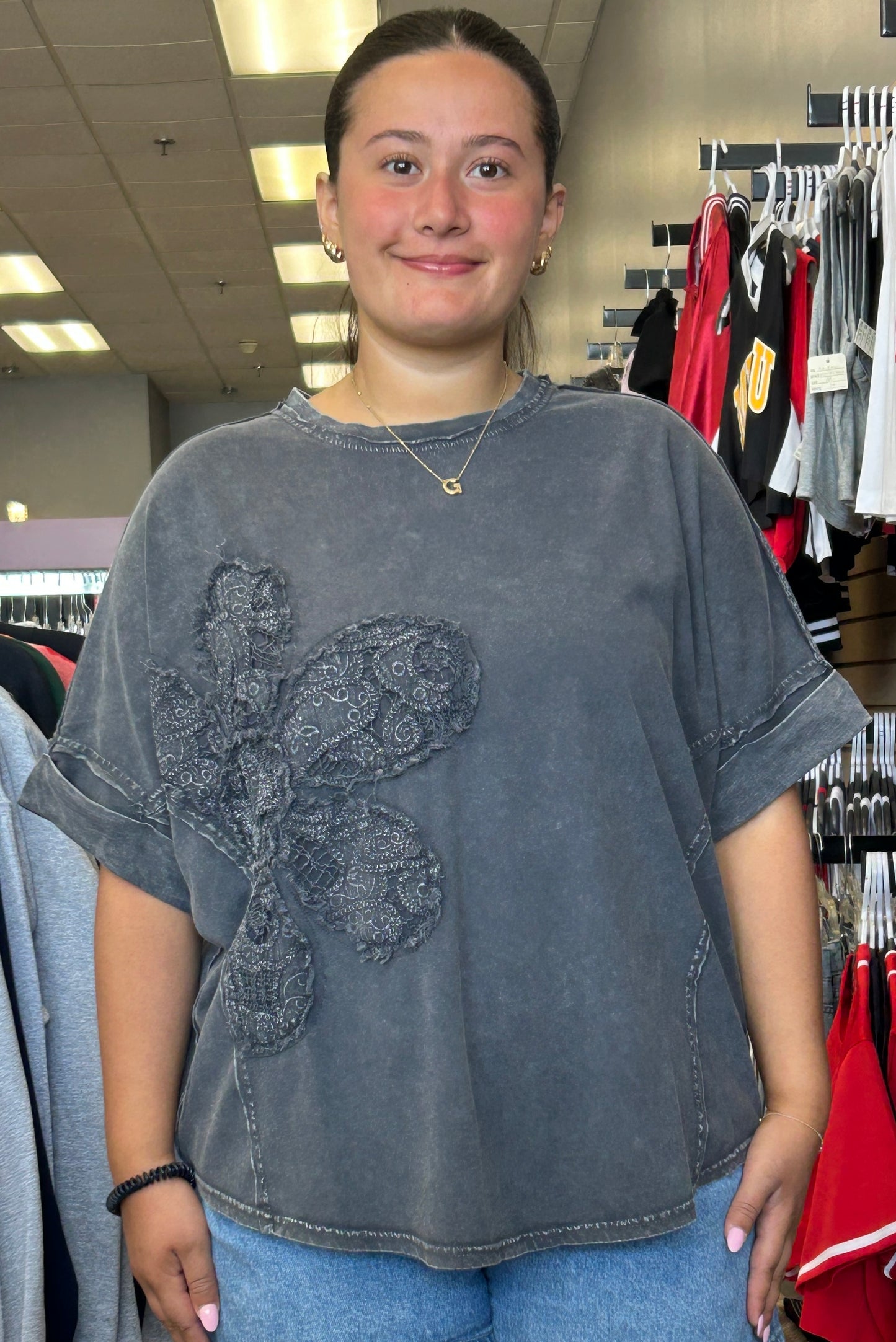 Dark grey top with lace flower patch
