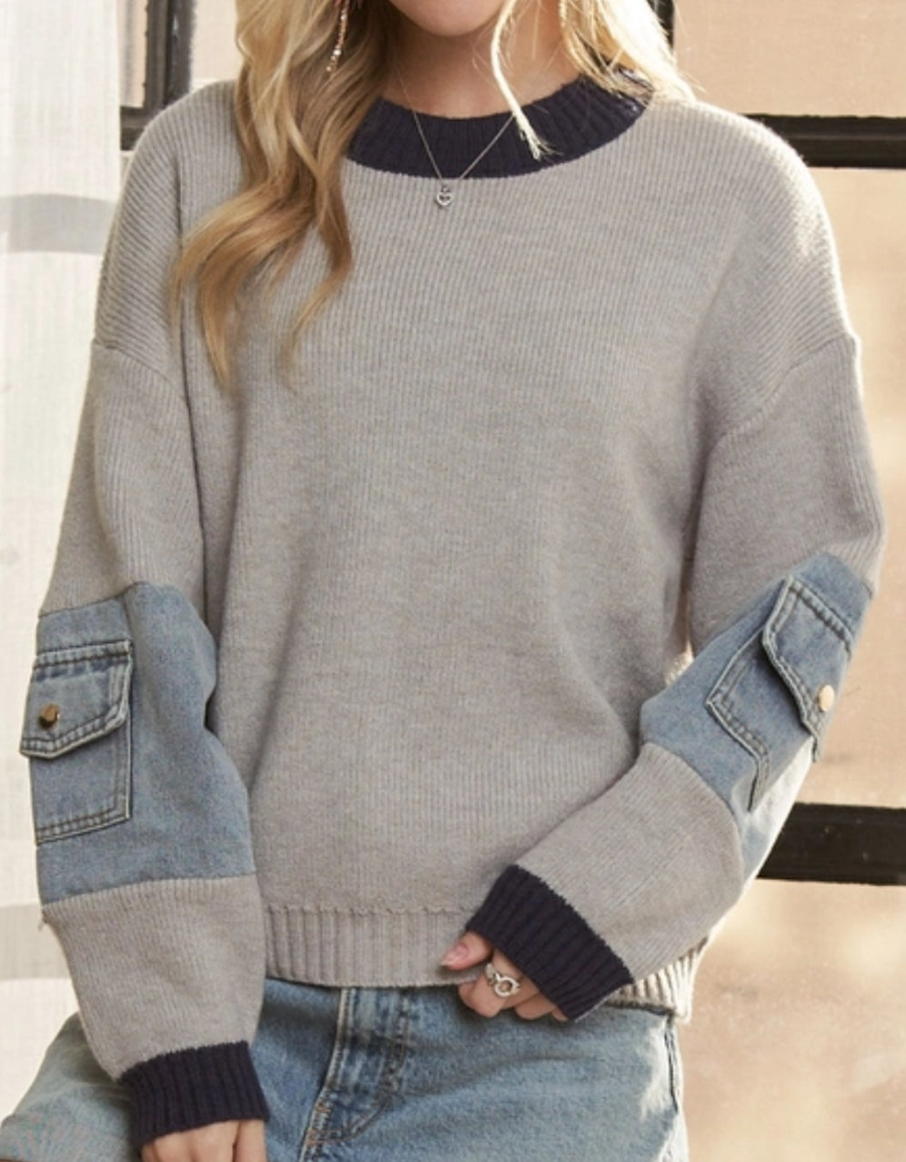 Grey sweater with colorblock trim and denim pockets