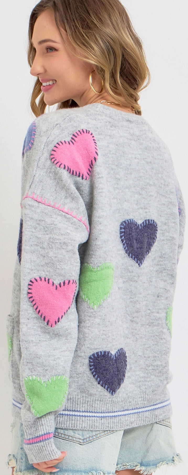 Grey sweater knit cardigan with multi heart patches