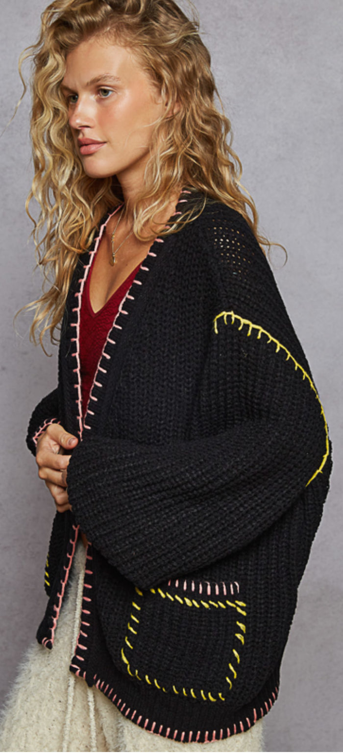 Black sweater knit open cardigan with neon pink and yellow stitching