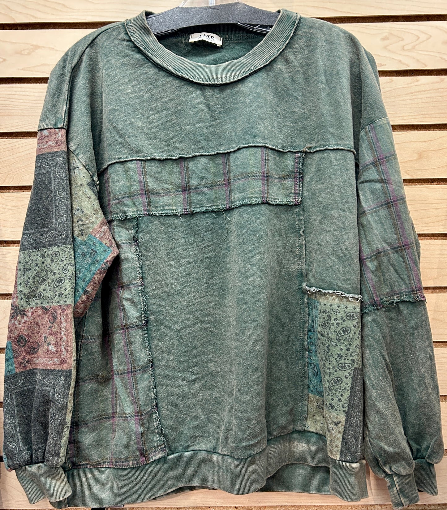 Green crew neck sweatshirt with plaid and bandana inserts