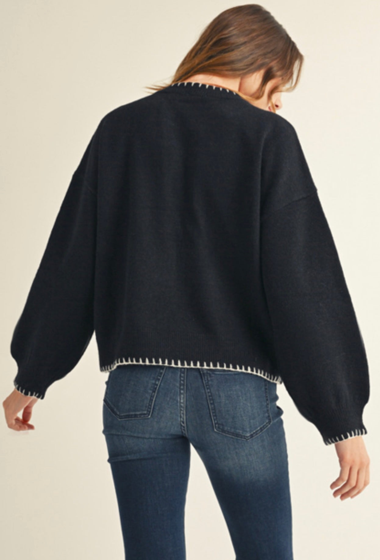 Black sweater with white daisy