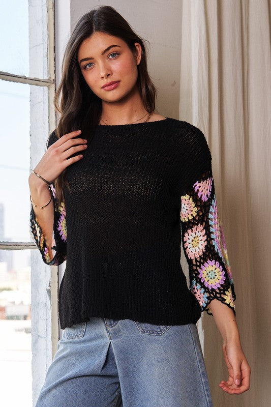 Black knit top with multi crochet sleeves