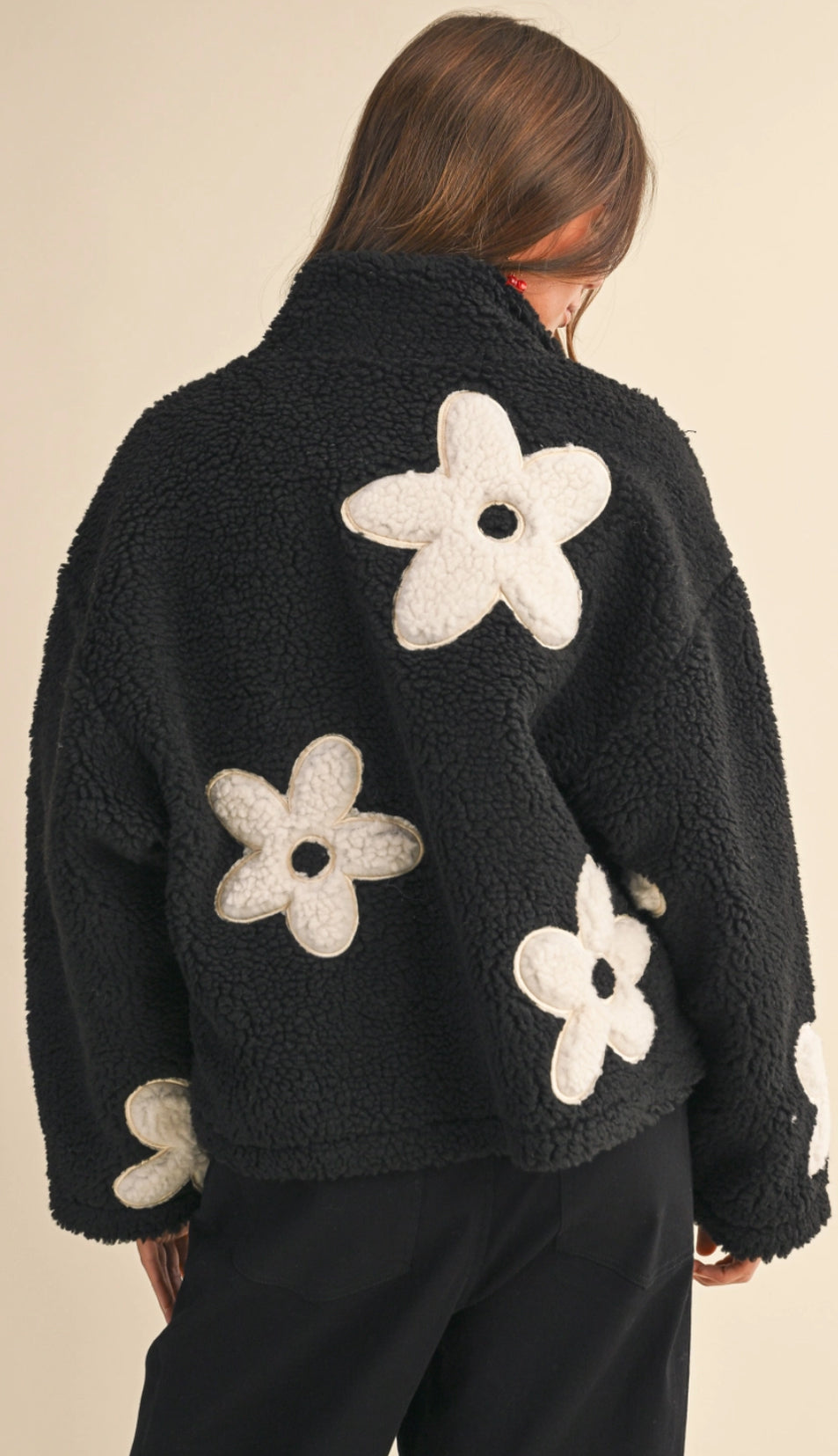 Black sherpa jacket with white daisies