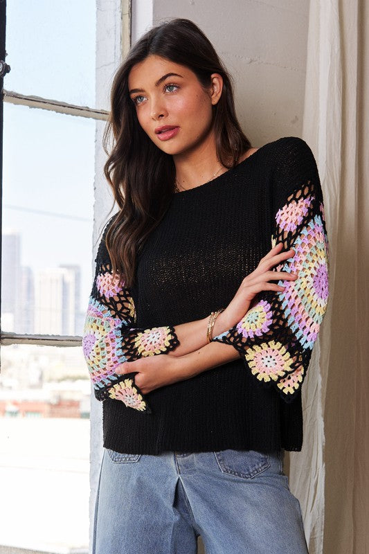 Black knit top with multi crochet sleeves