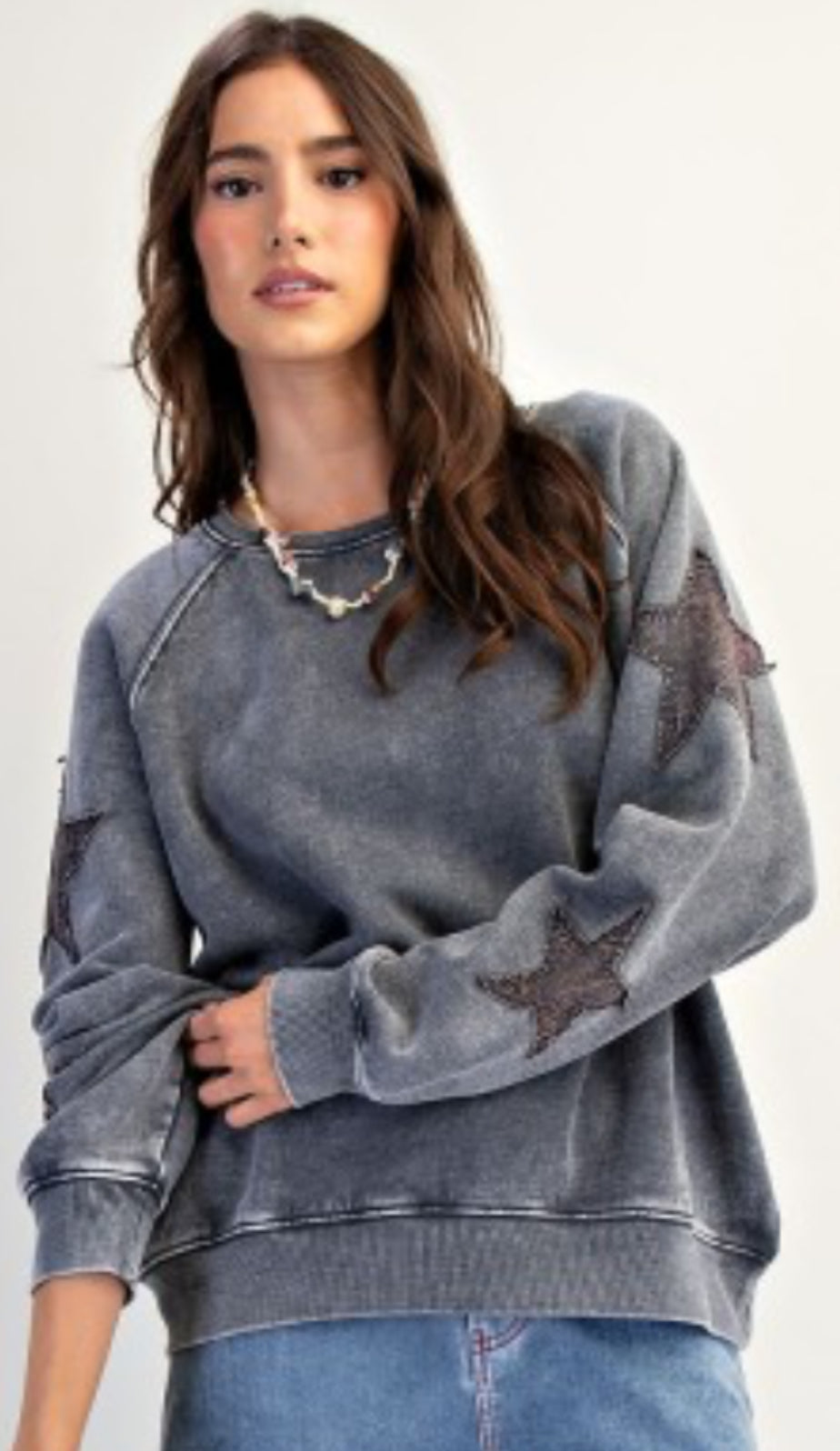 Grey sweatshirt with star patches on sleeves
