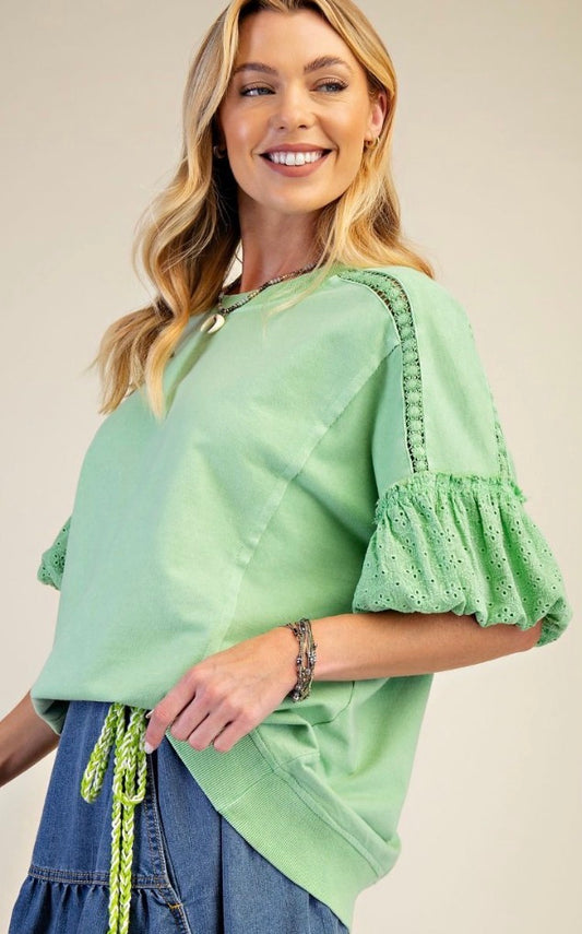 Apple green sweatshirt with puff sleeves and eyelet detail