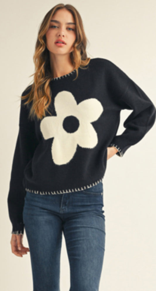 Black sweater with white daisy