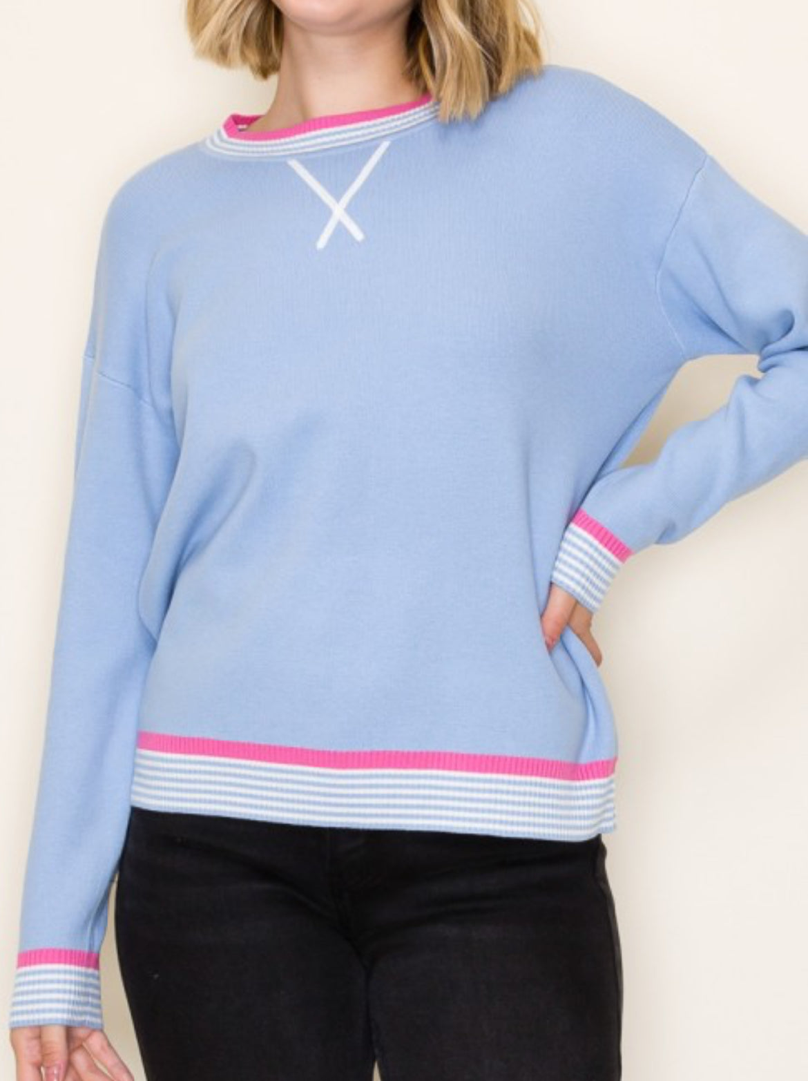 Blue knit top with pink stripe trim