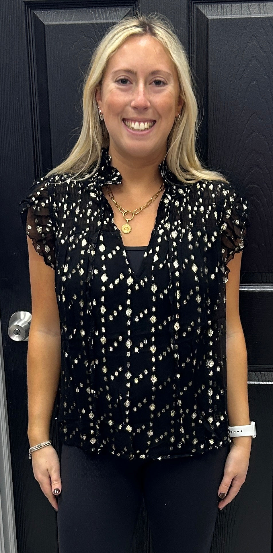 Black flutter sleeve top with metallic gold dots and optional front tie