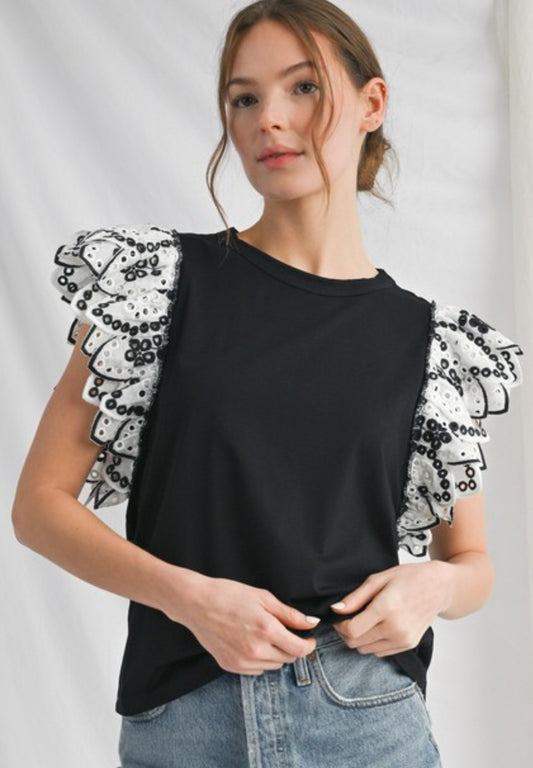 Black top with black/white eyelet ruffle sleeves