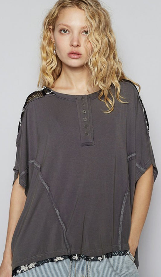 Charcoal grey loose fit henley top with floral netting inserts