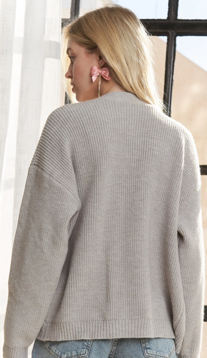 Grey sweater cardigan with denim pockets and gold buttons