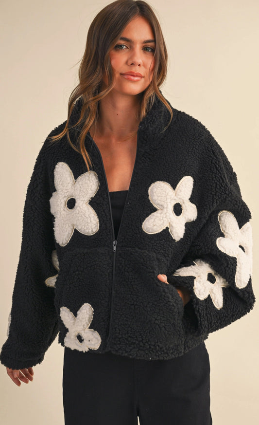 Black sherpa jacket with white daisies