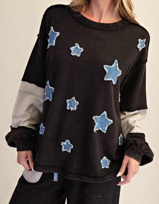 Black loose fit hi/lo top with denim stars and grey sleeve stripes