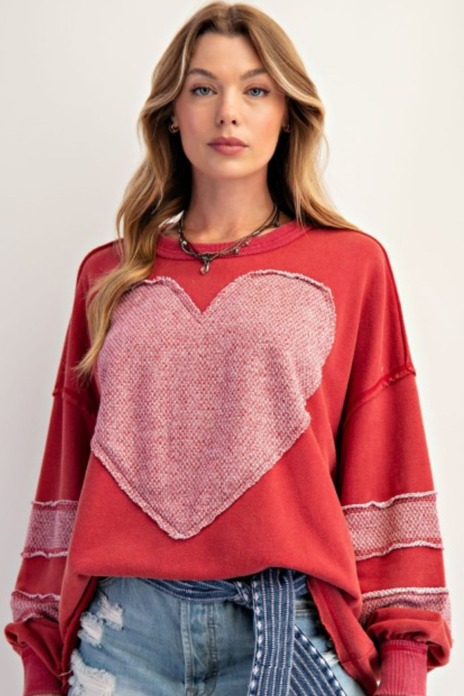 Red loose fit sweatshirt with large heart and sleeve stripes