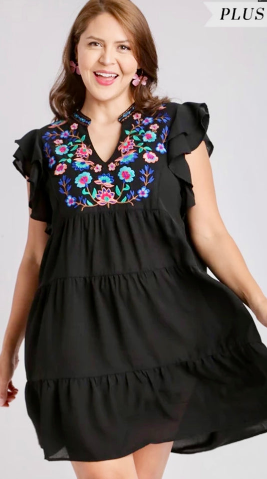 Plus size black tiered dress with multicolor floral detail