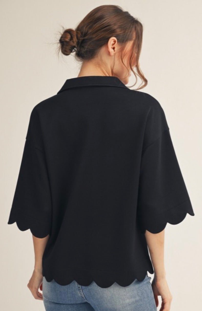 Black soft knit top with leopard trim and scallop bottom and elbow sleeves
