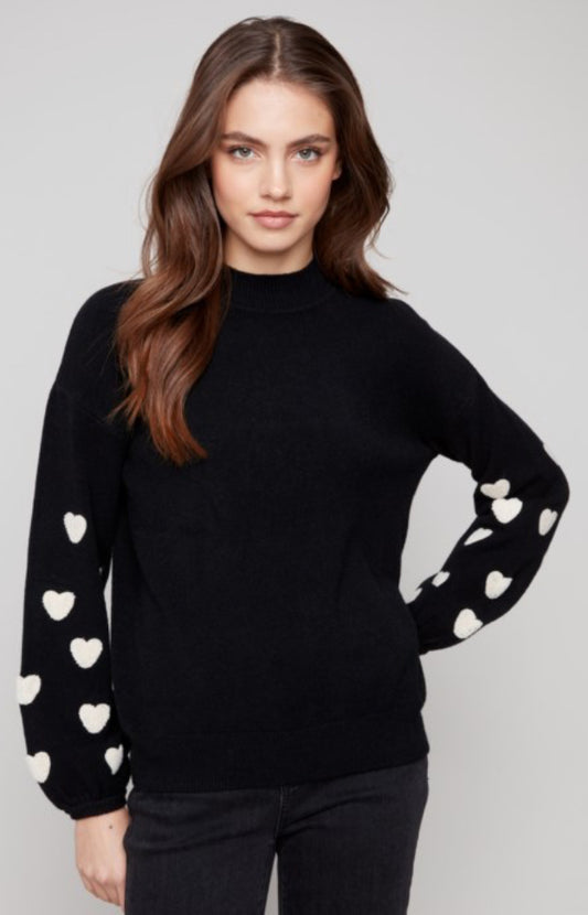 Charlie B black sweater with white hearts on sleeves