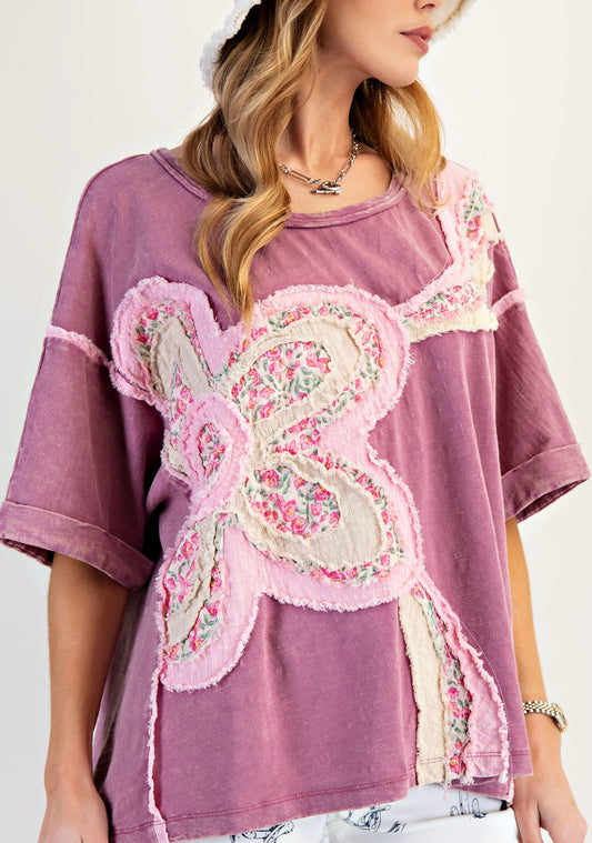 Plum top with mixed floral daisy patches
