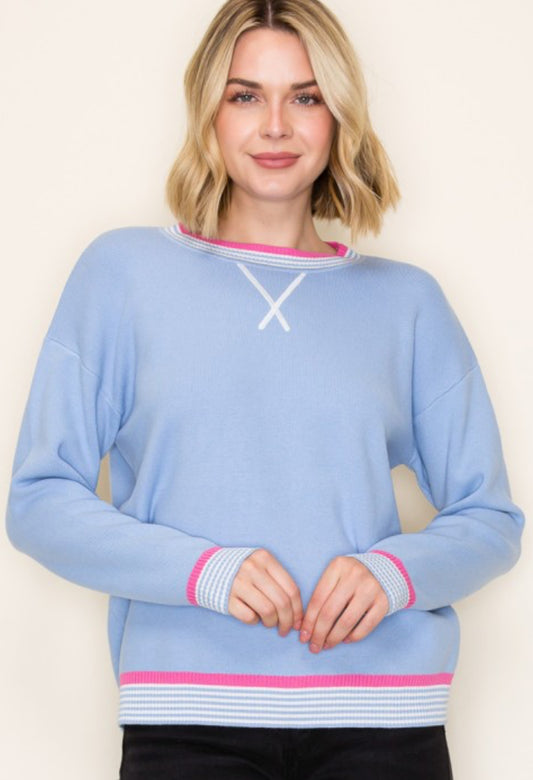 Blue knit top with pink stripe trim