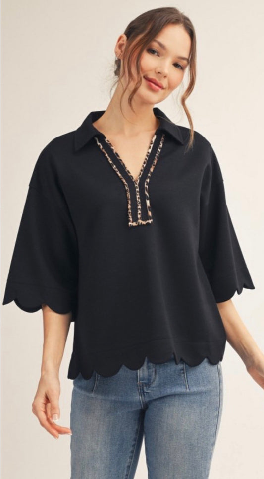 Black soft knit top with leopard trim and scallop bottom and elbow sleeves