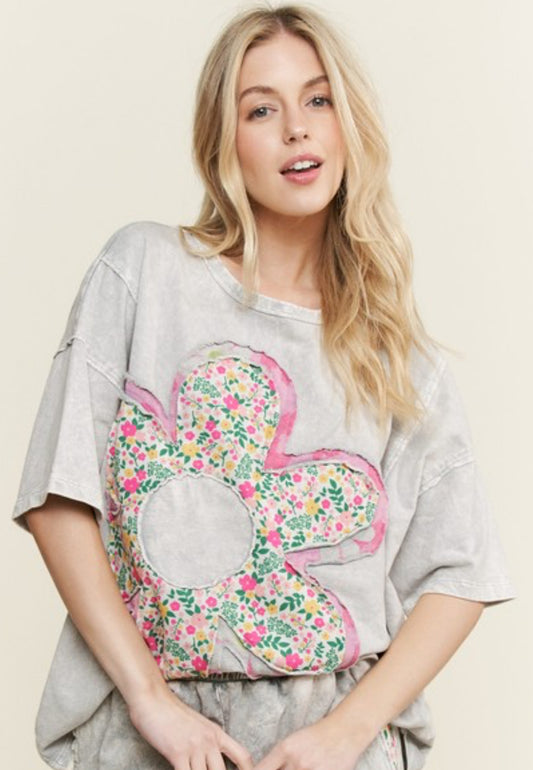 Grey loose fit top with floral large daisy with pink trim