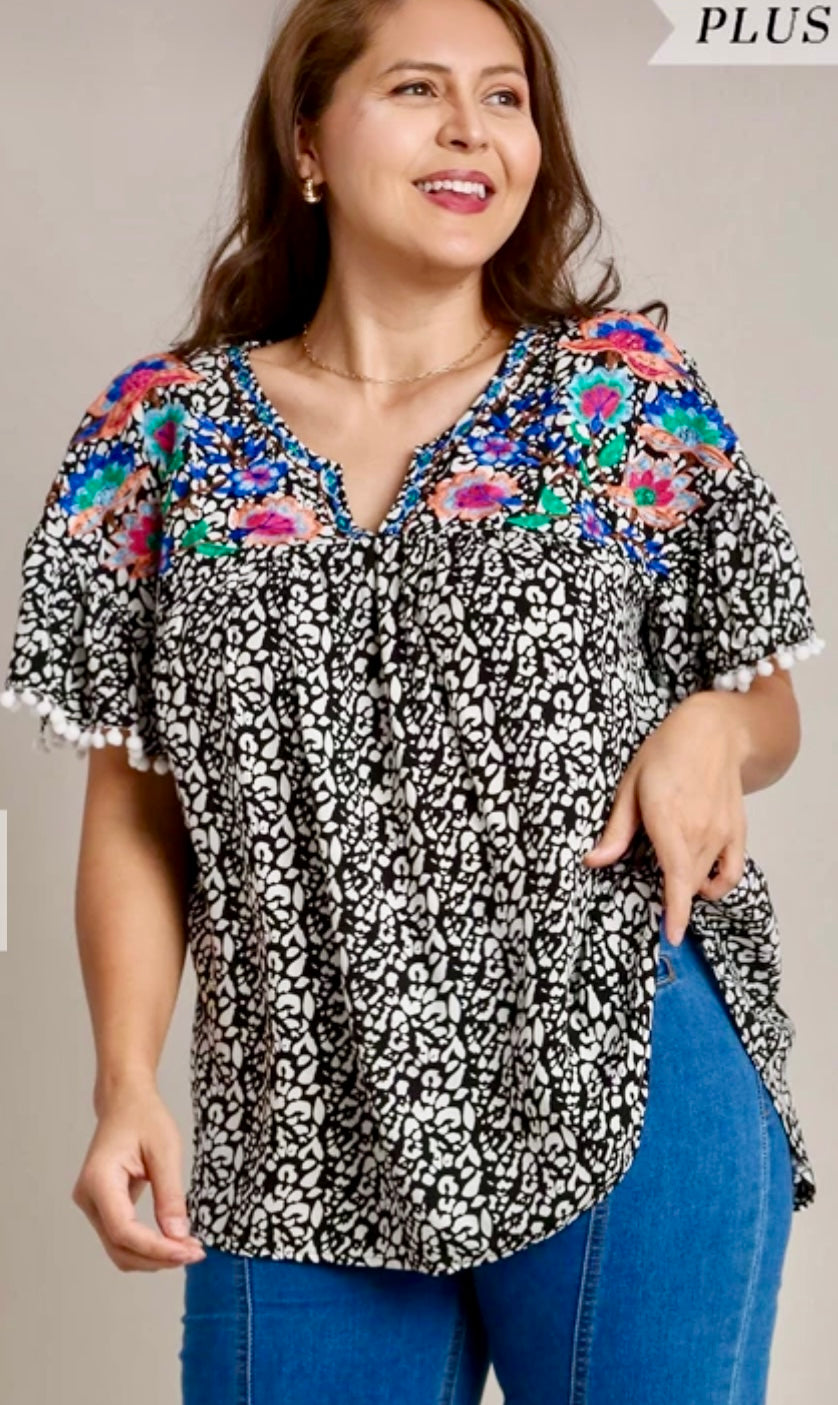 Plus size print top with floral and poms detail