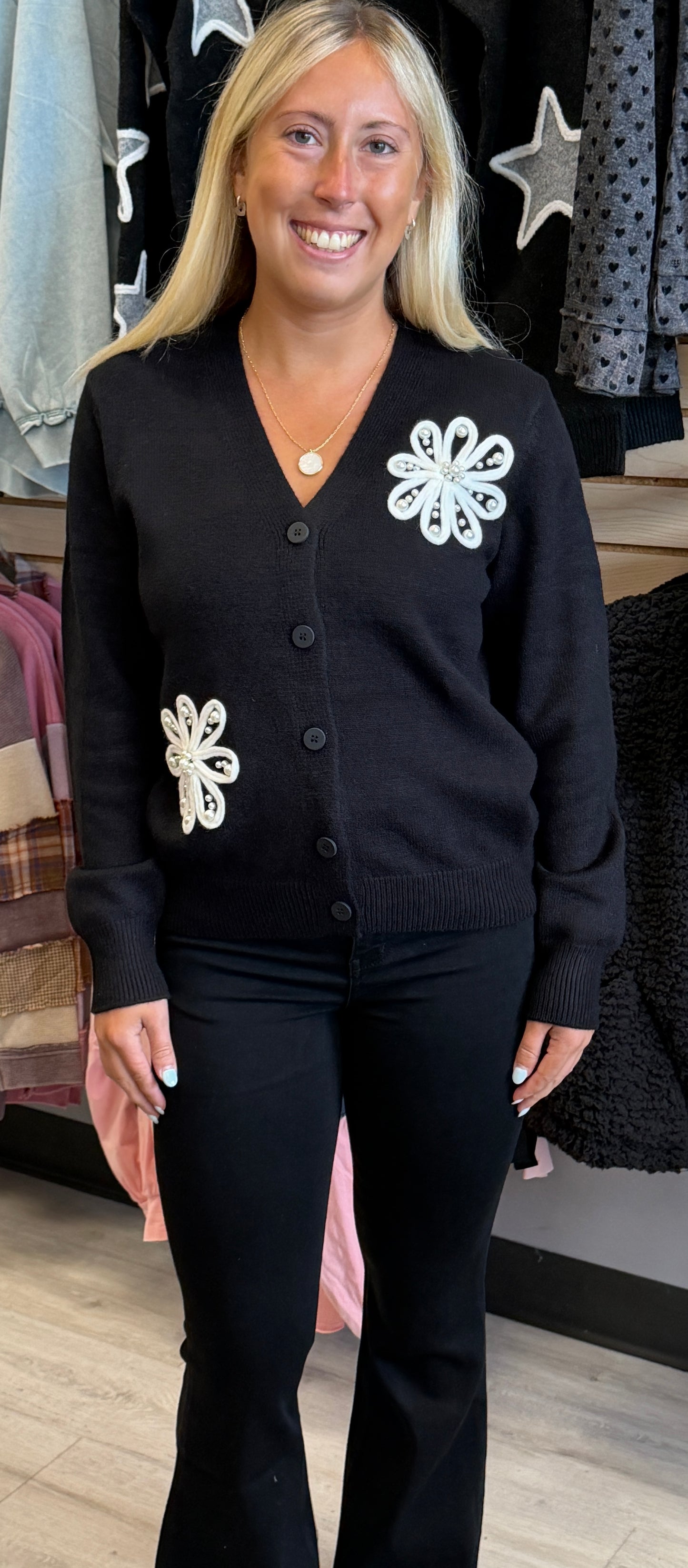 Black sweater knit cardigan with pearl filled flowers