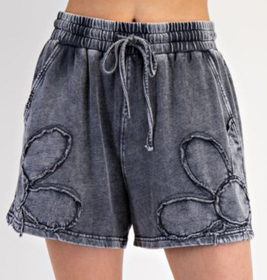 Mineral wash black shorts with tonal daisies