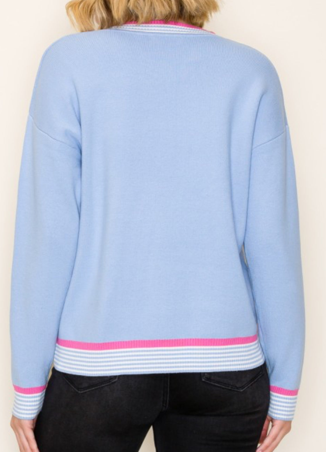 Blue knit top with pink stripe trim