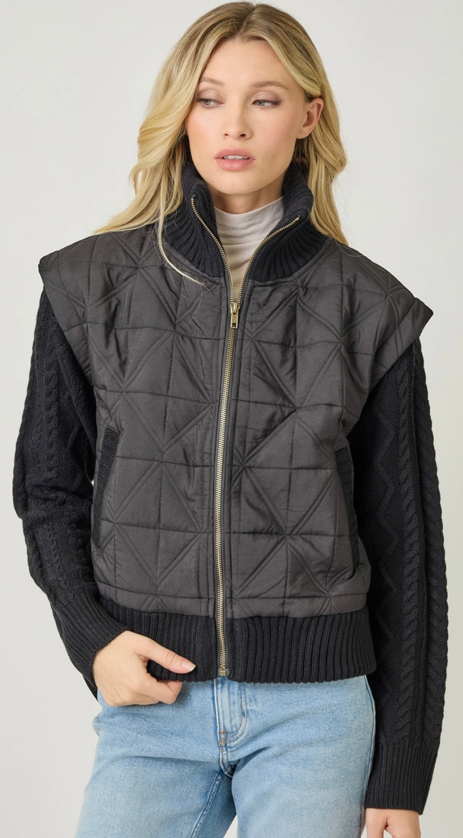 Black 2fer puffer vest with sweater knit sleeves attached