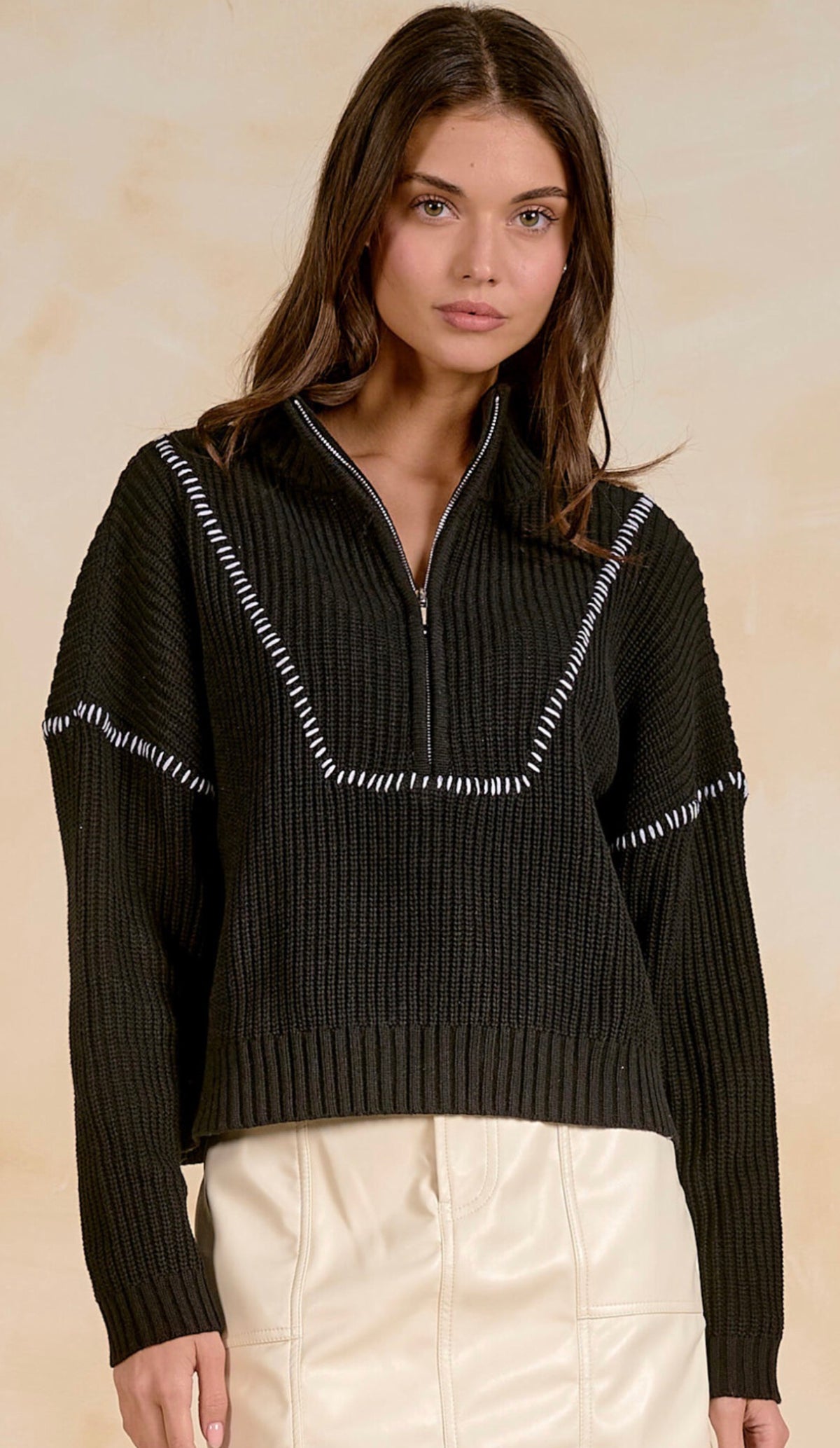 Black soft knit quarter zip sweater with white stitching