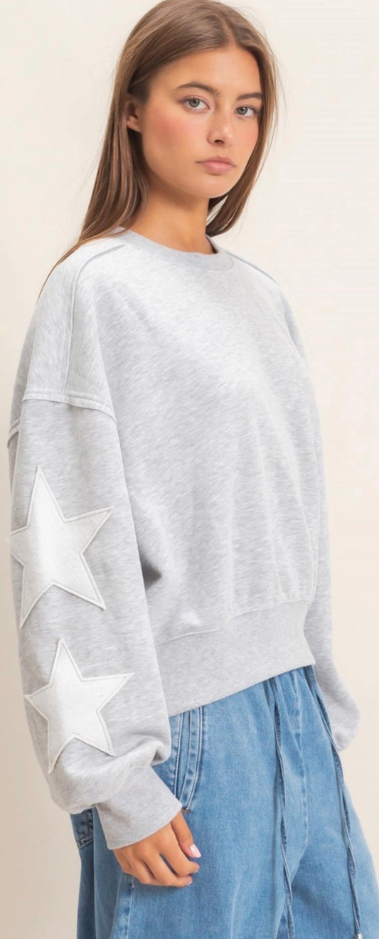 Grey sweatshirt with white stars on sleeves