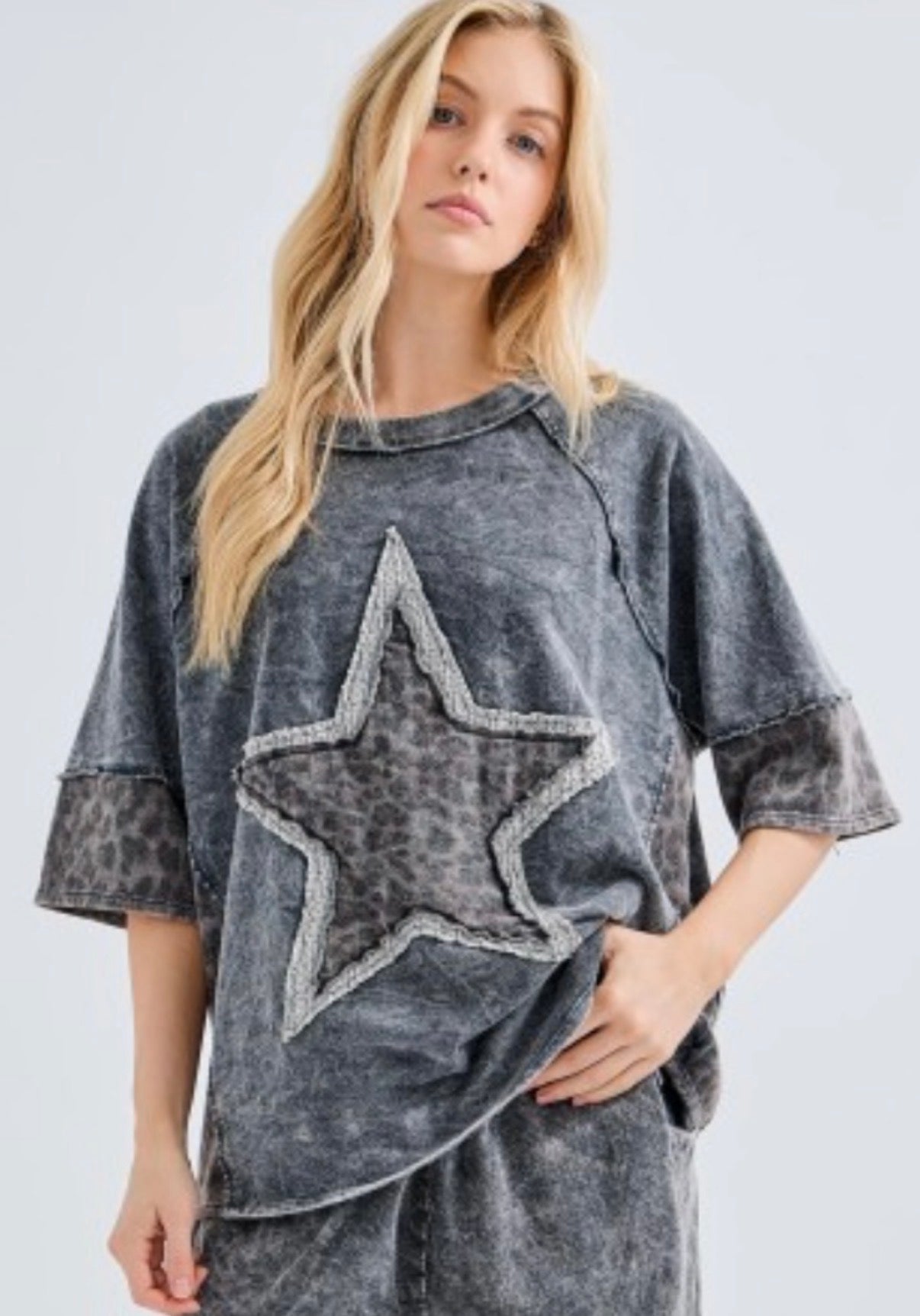 Mineral wash black top with leopard star and sleeve trim