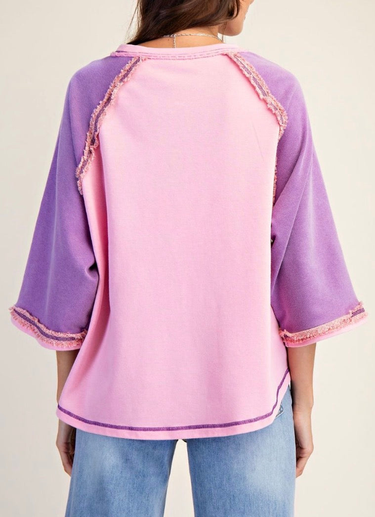Runs generous…Pink loose fit raglan top with lilac sleeves